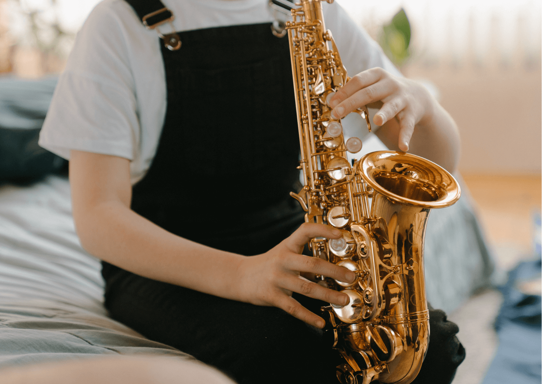 Picture of a person learning to play saxophone